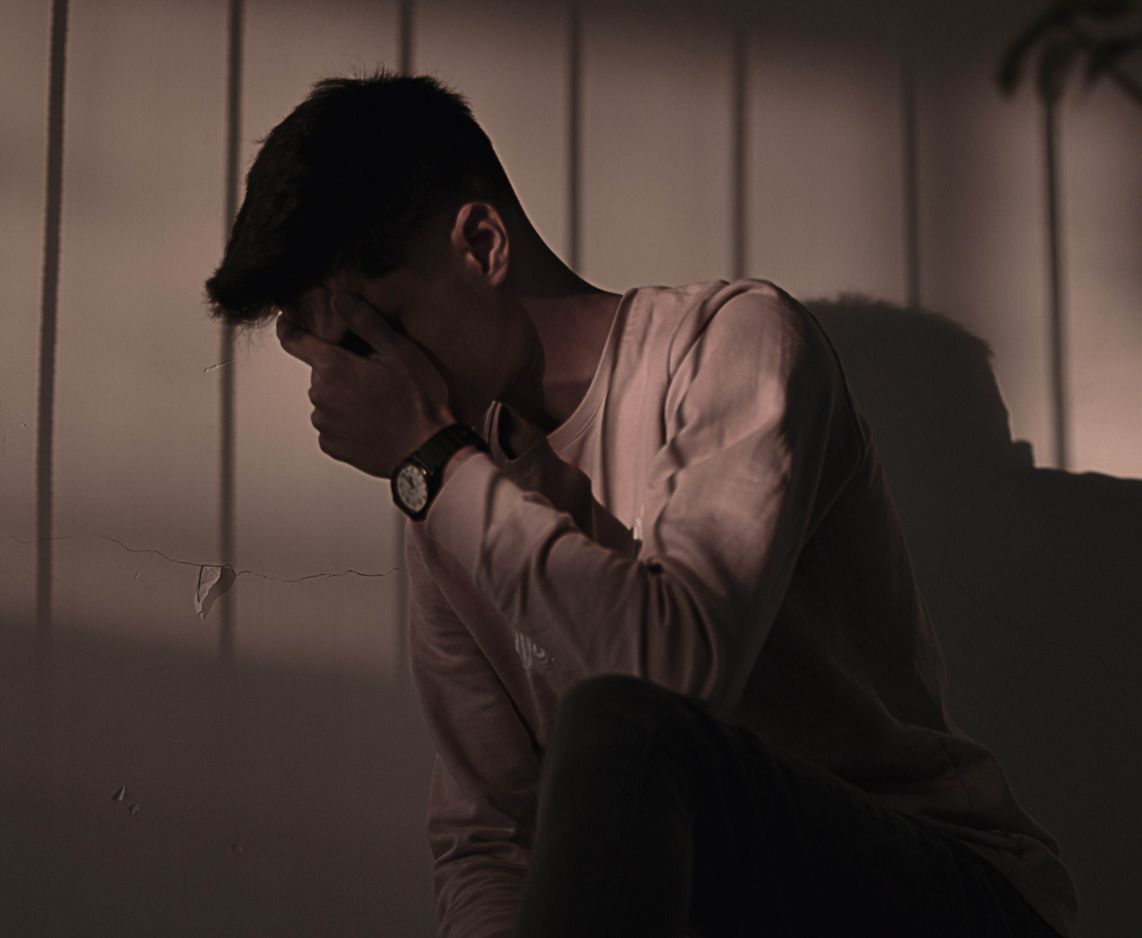 A grieving father holds his son after a late term abortion