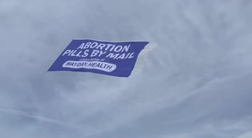 ‘What does that say’?: Airplane pulling abortion pill banner flies over U.S. Open